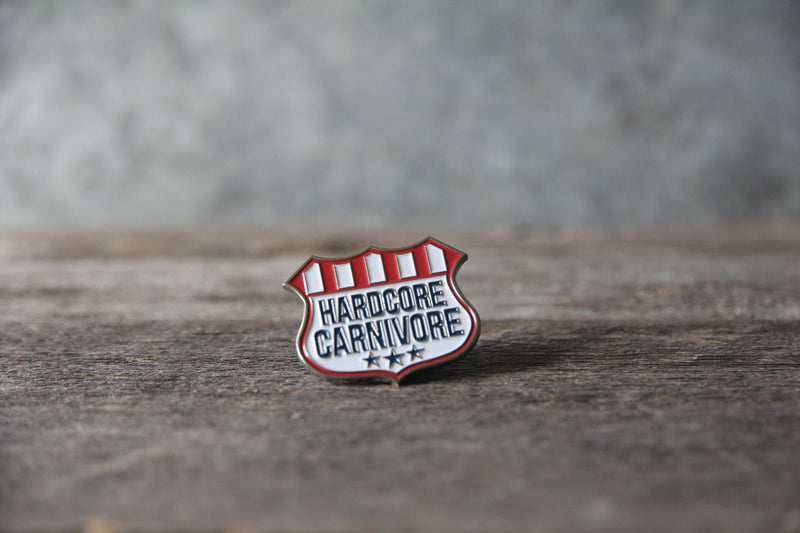 Hardcore Carnivore shield logo enamel pin